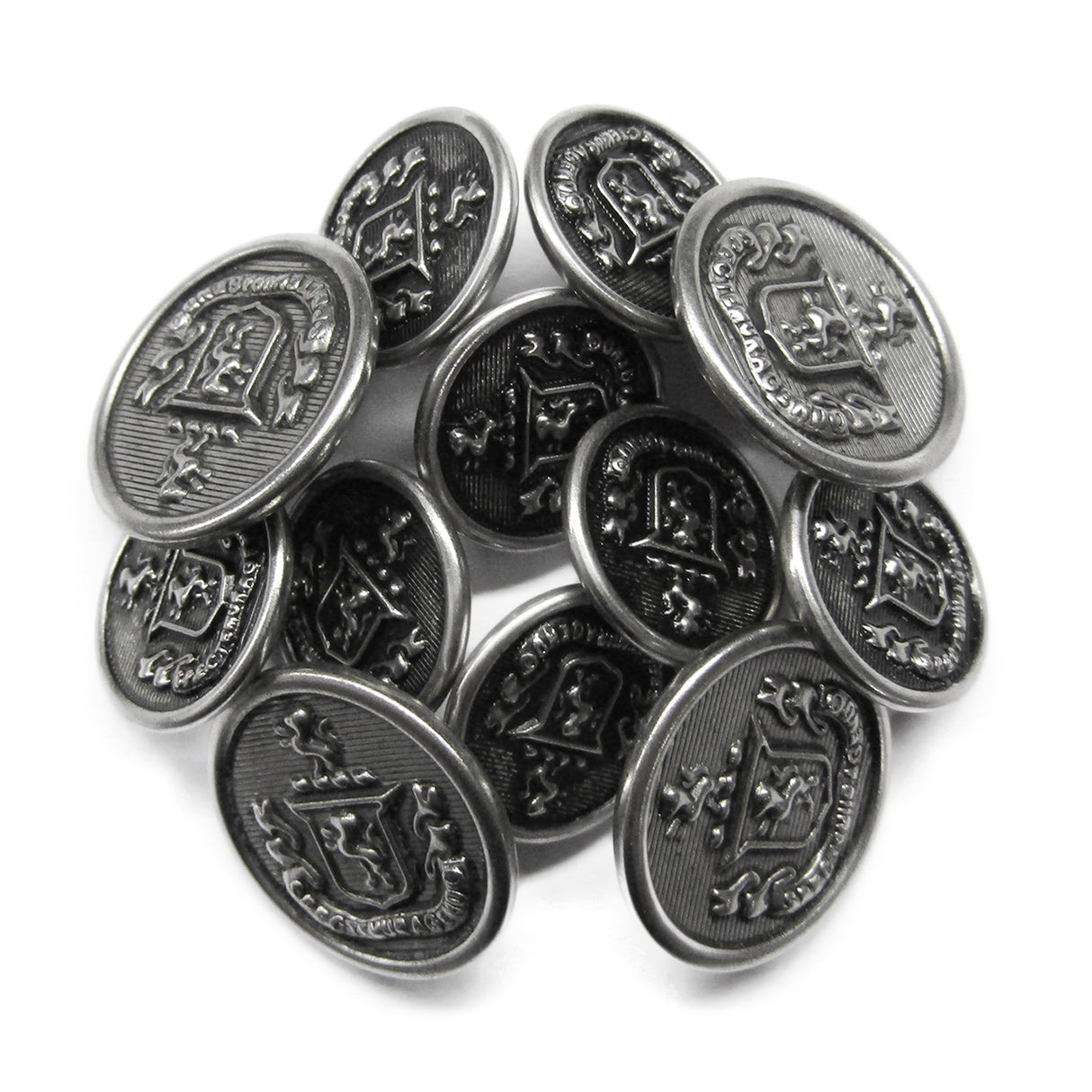 A pile of Lion Crest Design Metal Blazer Buttons in silver, each featuring a raised crest and decorative edge text.