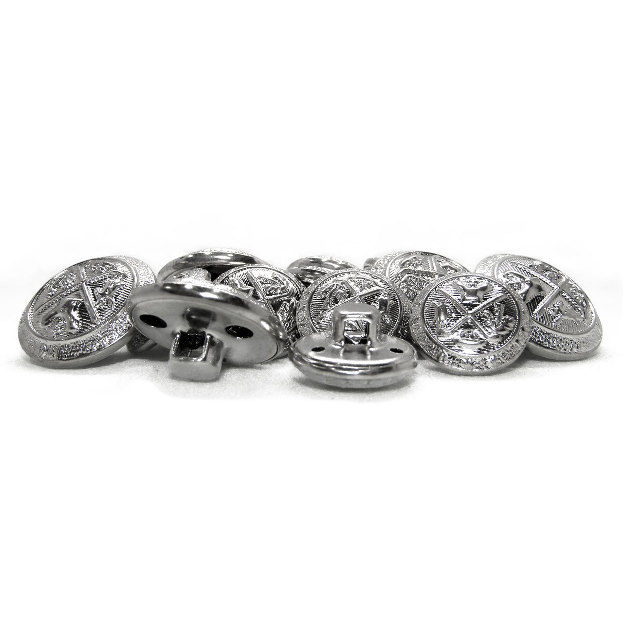 A pile of Coat of Arms Design Metal Blazer Buttons with intricate engraved patterns is displayed on a white surface, evoking classic style.