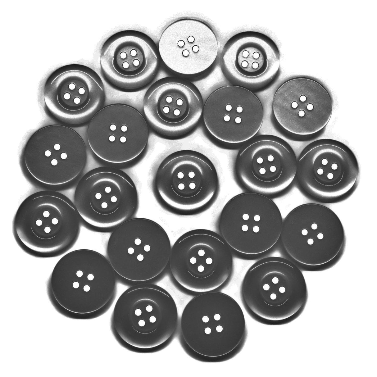 Several black and gray Commercial Food Service Buttons with four holes are arranged in a spiral pattern on a white background.