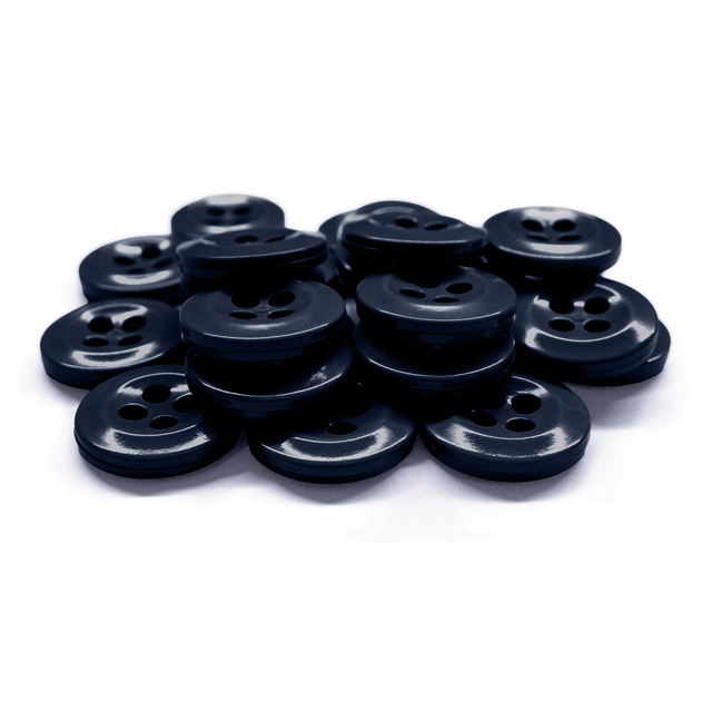 A pile of Work Shirt Buttons, black with four holes, stacked on a white surface.