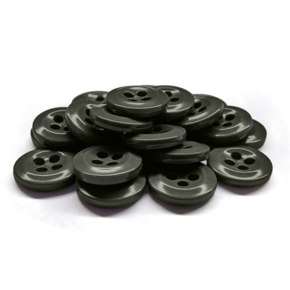 A stack of black, round, four-hole Work Shirt Buttons lies on a white surface.