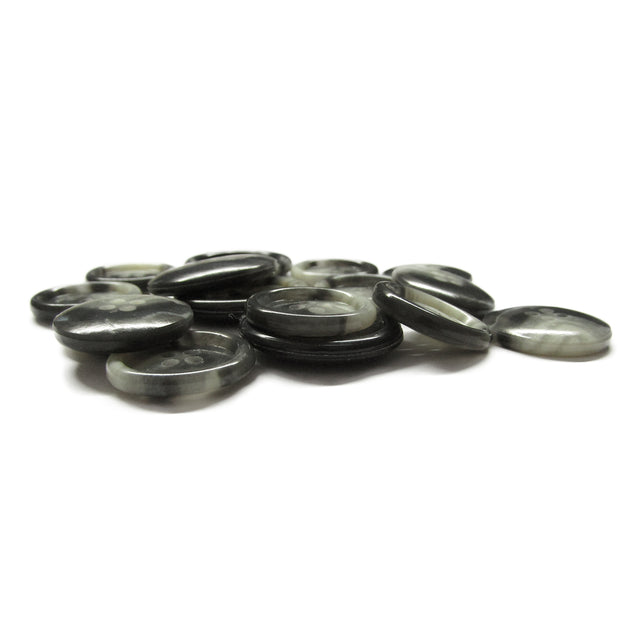 A pile of Premium Suit Buttons, round and flat in black and gray, scattered on a white surface.