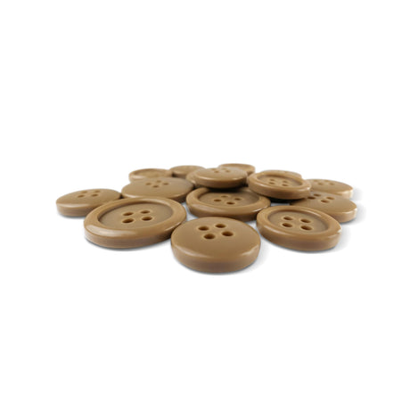 A pile of Basic Suit Buttons—round, light brown poly-nylon with four holes—arranged on a white background.