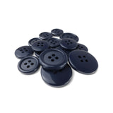 A selection of Basic Suit Buttons in assorted dark blue poly-nylon, various sizes for suits and blazers, displayed on a white background.