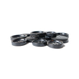 Buffalo Horn Suit Buttons are scattered in a pile on a white background.