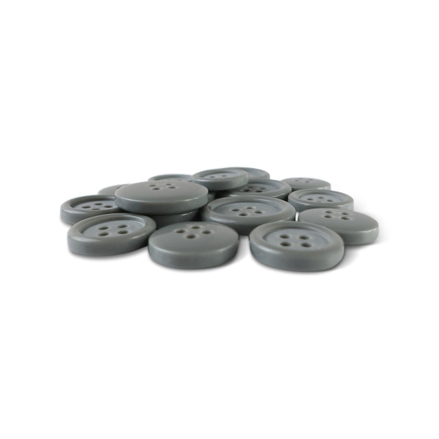A pile of Basic Suit Buttons, gray with four holes and made from poly-nylon, arranged on a white background.