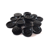 Buffalo Horn Suit Buttons in black with four holes are arranged on a white background—ideal as luxury buttons for coats or elegant suit fastenings.