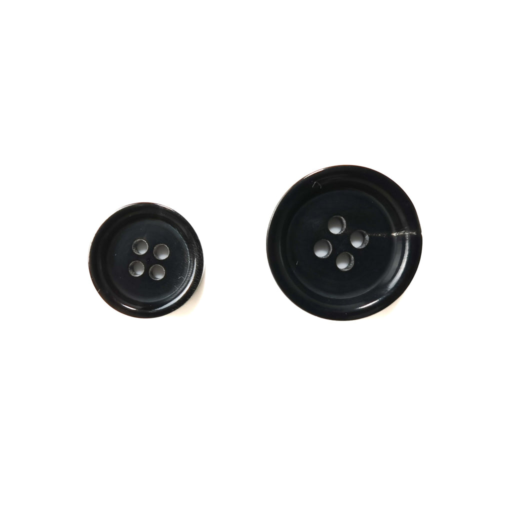 Two Buffalo Horn Suit Buttons, one small and one large, both black with four holes, are shown on a white background.