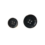 Two Buffalo Horn Suit Buttons, one small and one large, both black with four holes, are shown on a white background.