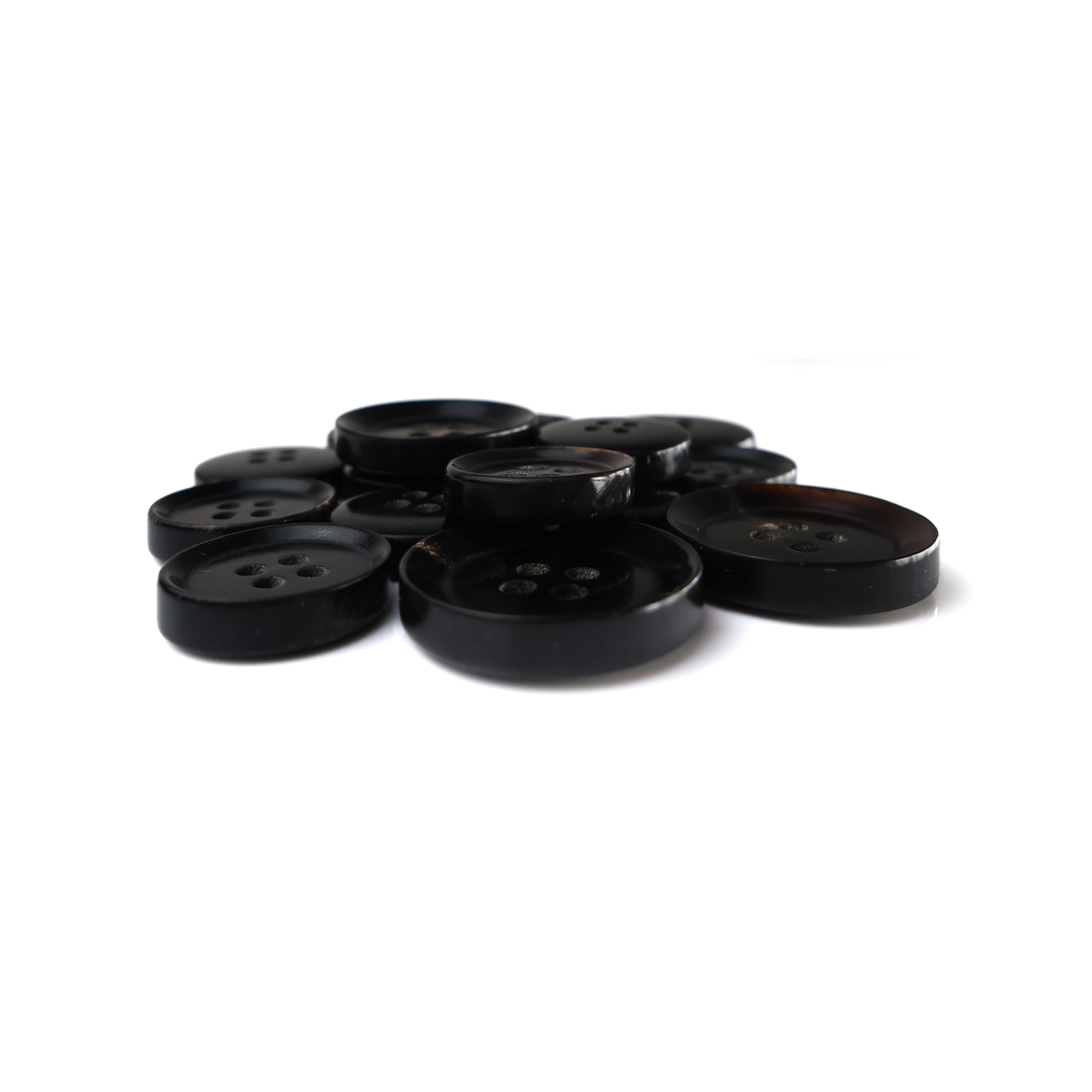Buffalo Horn Suit Buttons, round and black with four holes, are shown in a pile on a white background.