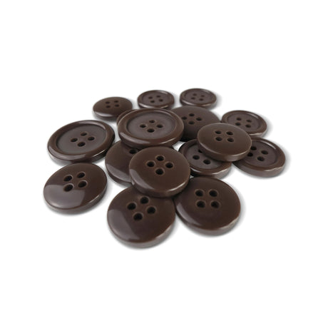 A pile of Basic Suit Buttons, dark brown, round, and featuring four holes, rests on a white background.