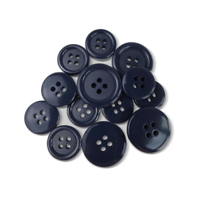 A selection of Basic Suit Buttons in dark blue poly-nylon, each with four holes and in assorted sizes, is displayed on a white background.