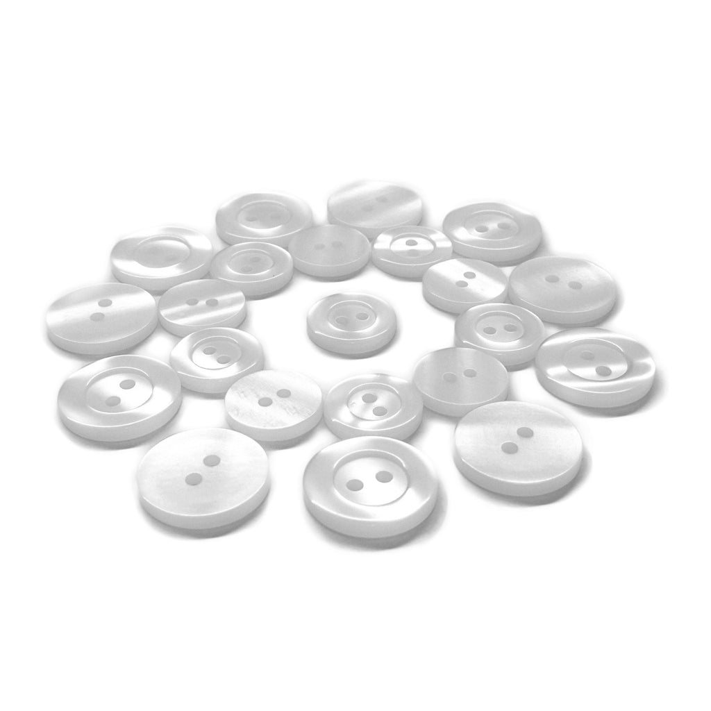A circle of Lab Coat Buttons in different sizes arranged on a white background.