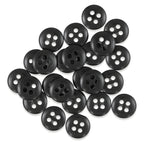 A pile of black Trouser Fly Pant Buttons with four holes scattered on a white background.