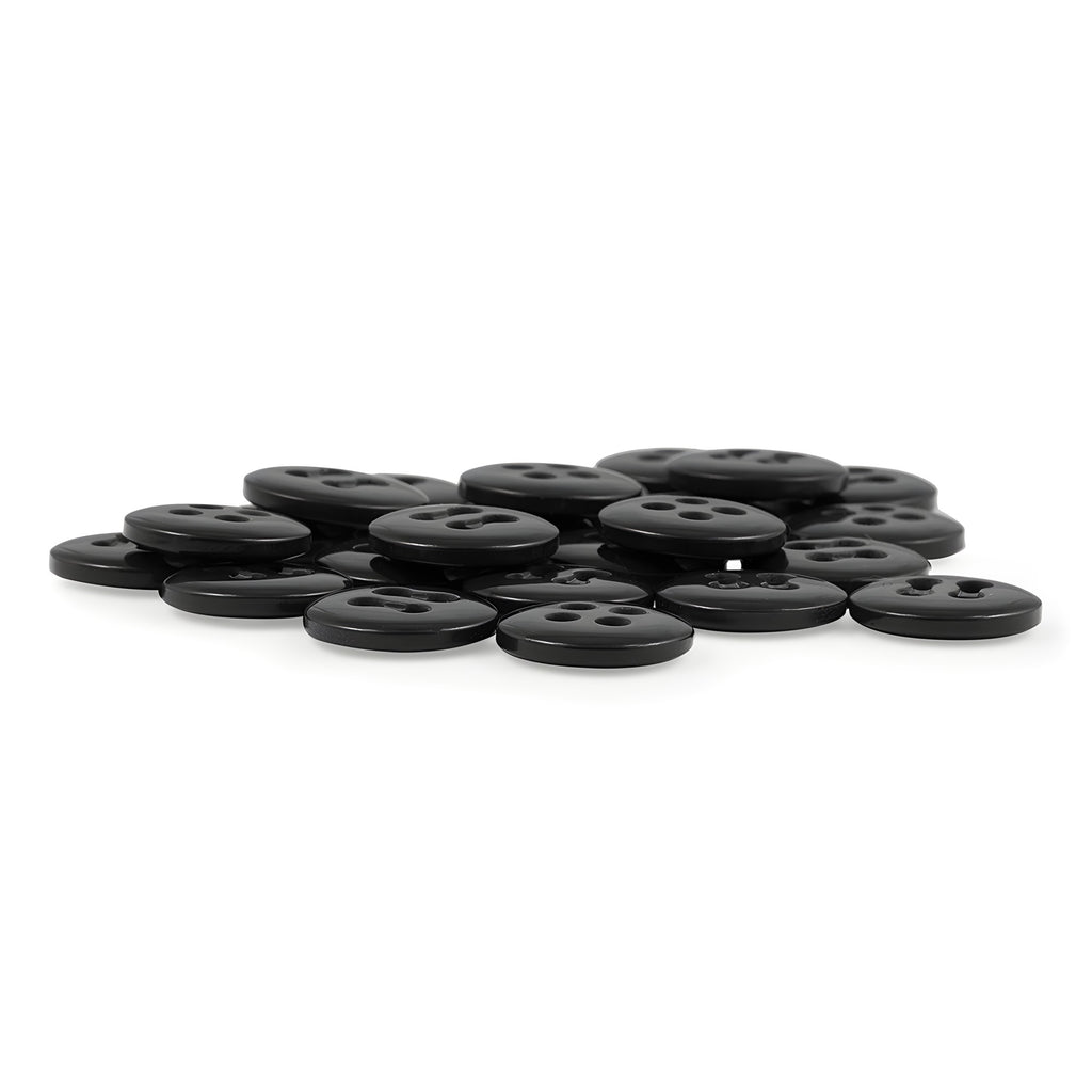 A pile of Trouser Fly Pant Buttons—small, round, navy, four-hole buttons—arranged on a white surface, perfect as garment replacement buttons.