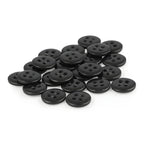 A set of small, round black Trouser Fly Pant Buttons with four holes each is displayed on a white background.