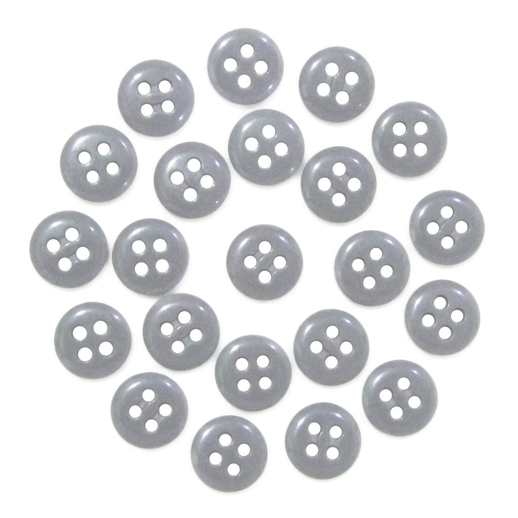 Twenty-four Trouser Fly Pant Buttons, gray with four holes, are arranged in an S shape on a white background.