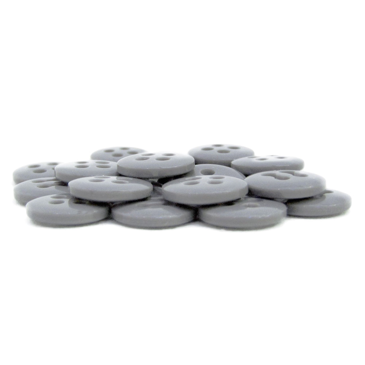 A set of flat, round, gray Trouser Fly Pant Buttons with four holes is displayed on a white background.