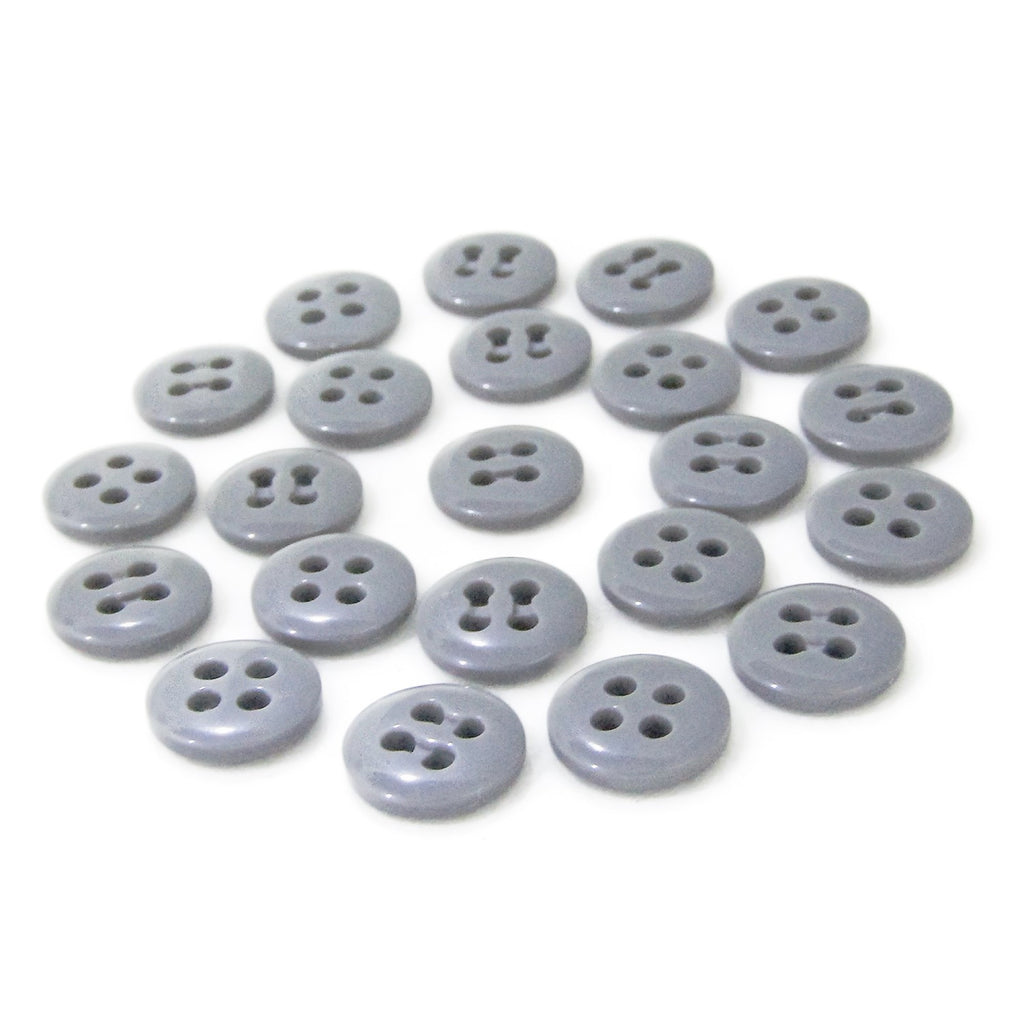 Twenty small round gray Trouser Fly Pant Buttons, featuring two and four holes, are neatly arranged in rows on a white background.