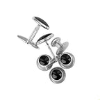 Four stainless steel Tuxedo Shirt Studs and Cufflinks with black circular centers are arranged on a white background—sleek accessories that elevate any formal outfit.