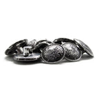 A pile of Salzburg Crest Design Metal Blazer Buttons with embossed shield designs is arranged on a white background.