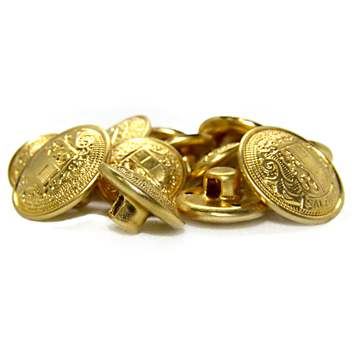 A pile of Salzburg Crest Design Metal Blazer Buttons featuring embossed patterns and back shanks, perfect as blazer replacements or for adding a stylish touch.
