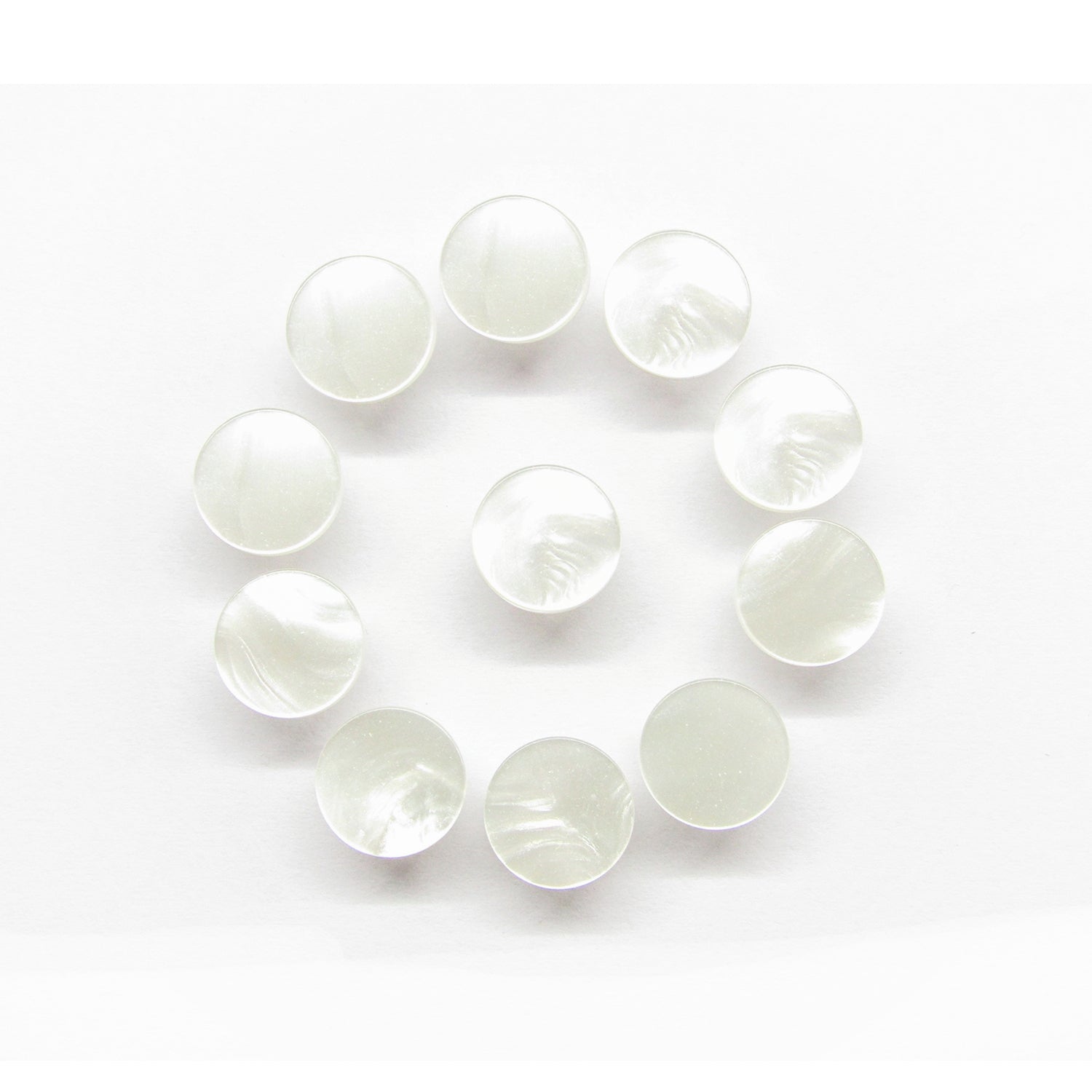 Ten Flat Bridal Trim and Bustle Buttons, round and translucent white, are arranged in a circle on a white background.