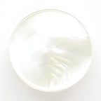 Flat Bridal Trim and Bustle Buttons: round, white, iridescent with a smooth, glossy surface—ideal for adding a delicate touch to women’s wear or as an elegant detail on wedding dresses.