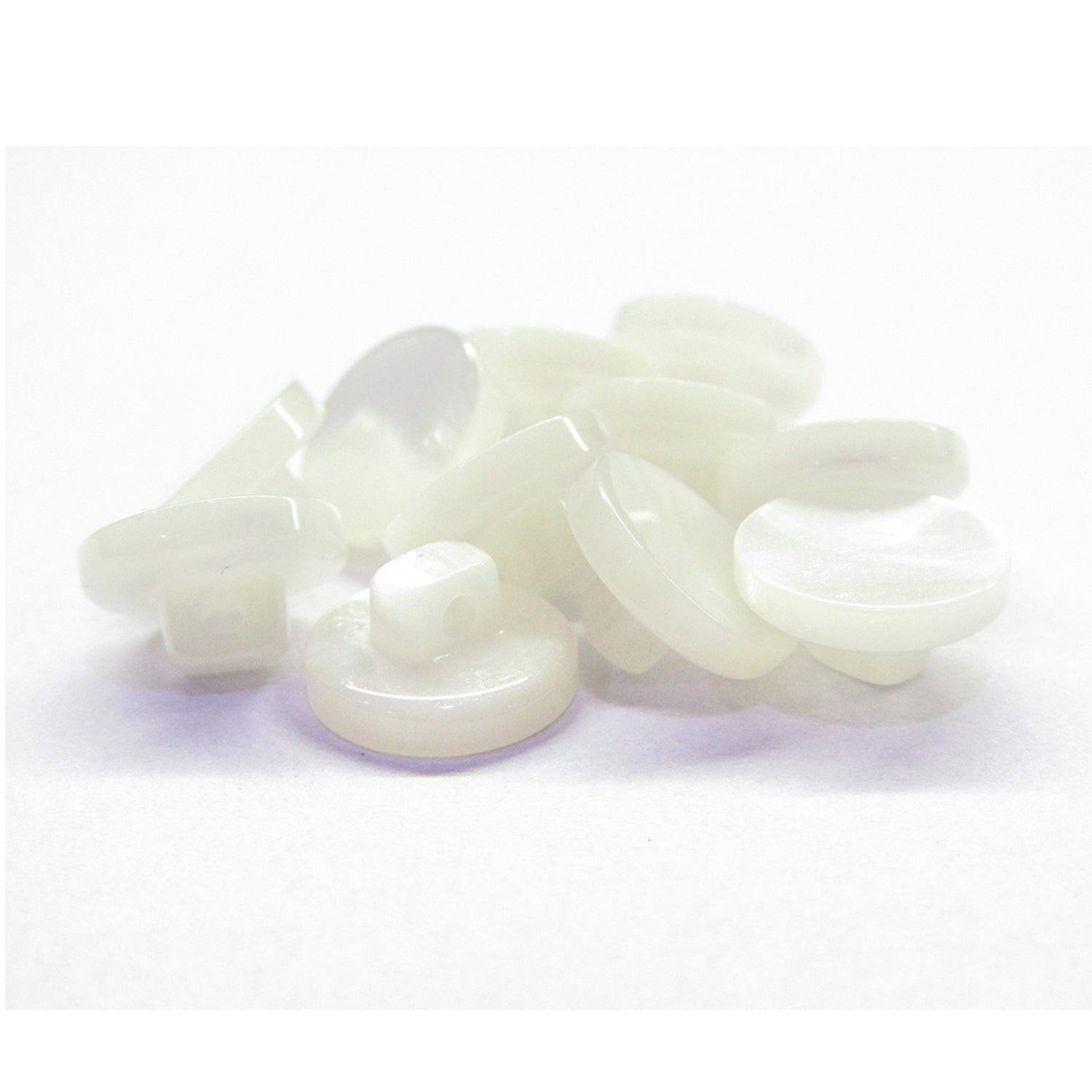 A pile of small, round, white Flat Bridal Trim and Bustle Buttons on a plain white background.