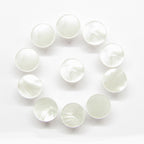 Twelve Flat Bridal Trim and Bustle Buttons with a glossy finish are arranged in a circle on a white background.