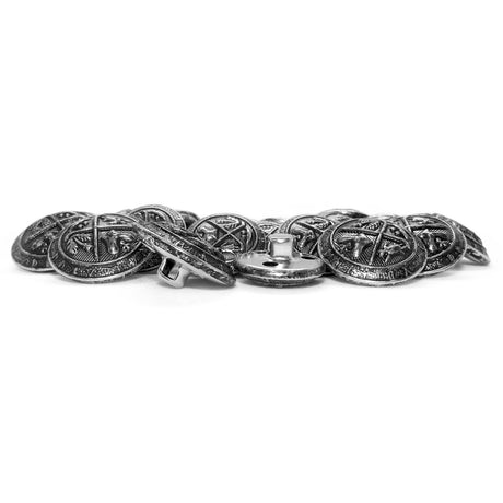 A pile of Coat of Arms Design Metal Blazer Buttons with intricate embossed patterns rests on a white background.