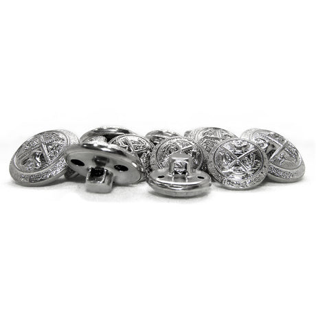 A pile of Coat of Arms Design Metal Blazer Buttons with intricate engraved patterns is displayed on a white surface, evoking classic style.