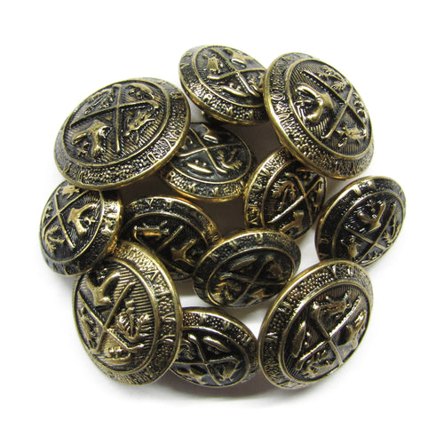 A pile of round Coat of Arms Design Metal Blazer Buttons with intricate raised patterns and dark accents, ideal for adding a vintage touch.