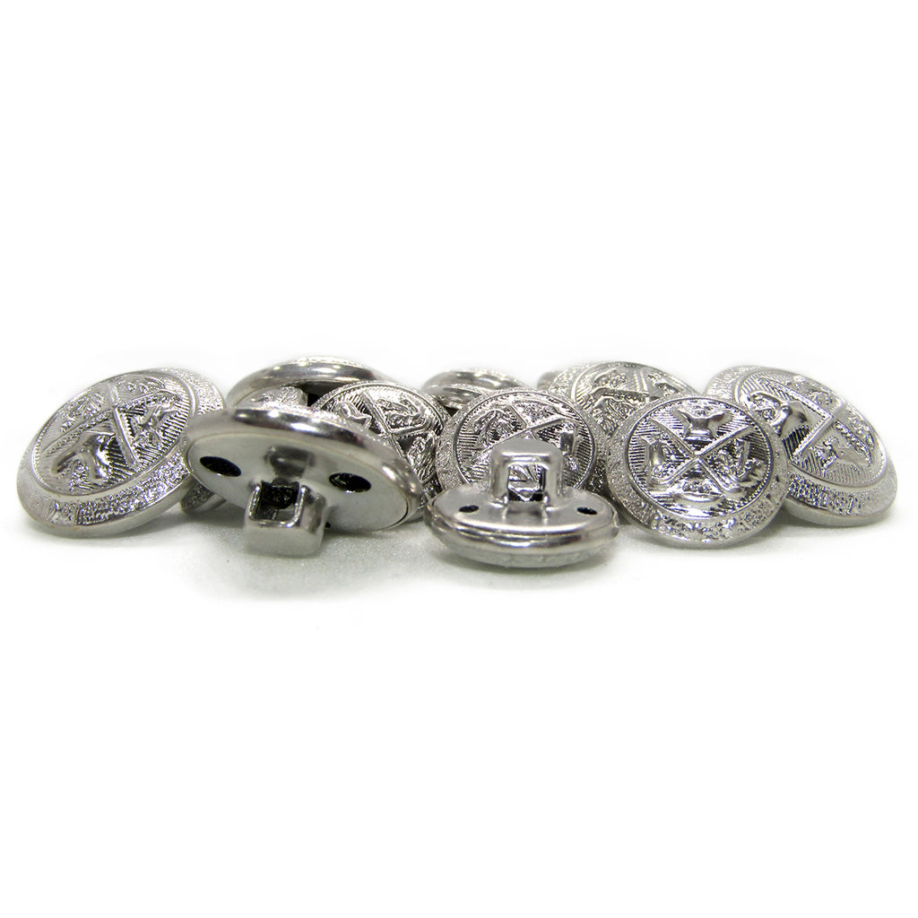 A pile of Coat of Arms Design Metal Blazer Buttons in silver, some lying flat to display their engraved designs and others flipped to reveal the shank on the back.