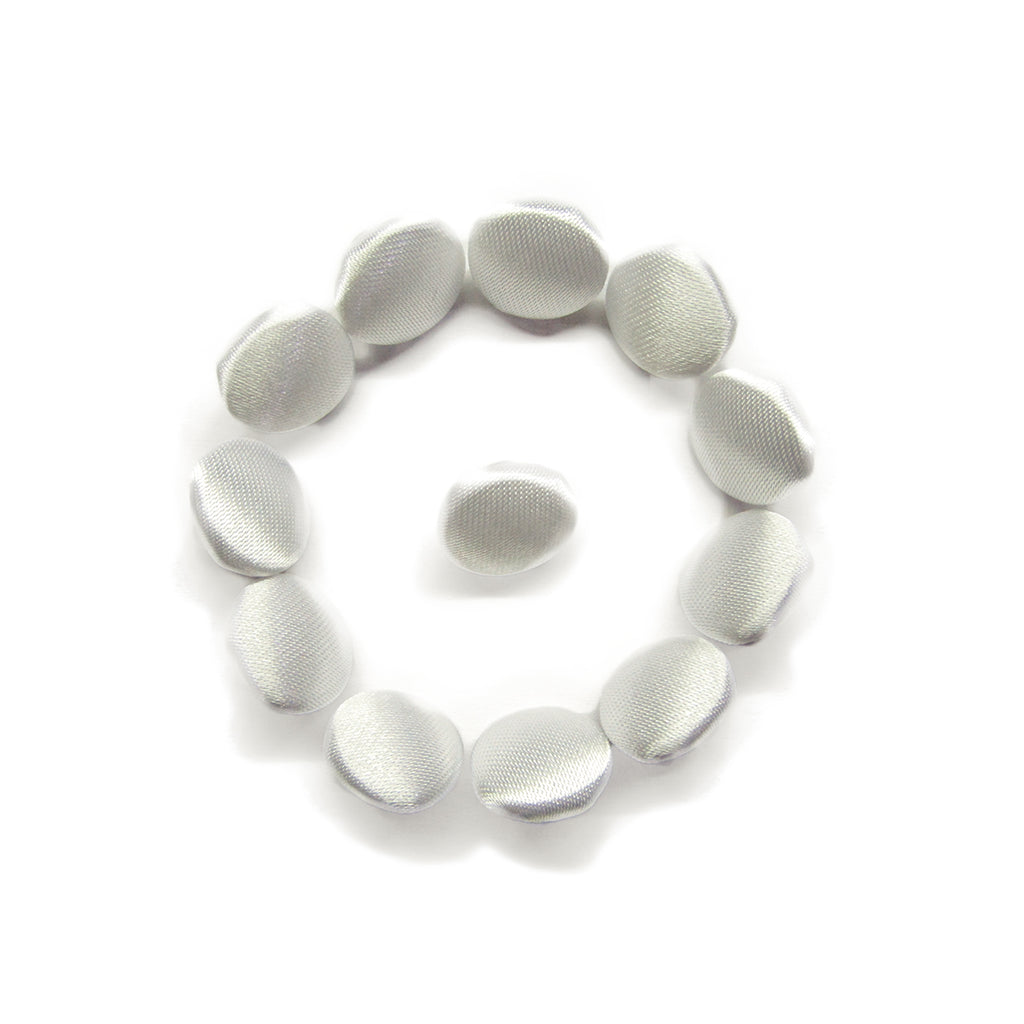 Twelve Silk Satin Bridal Buttons, small, white, and round, are arranged in a circle with one in the center on a white background.