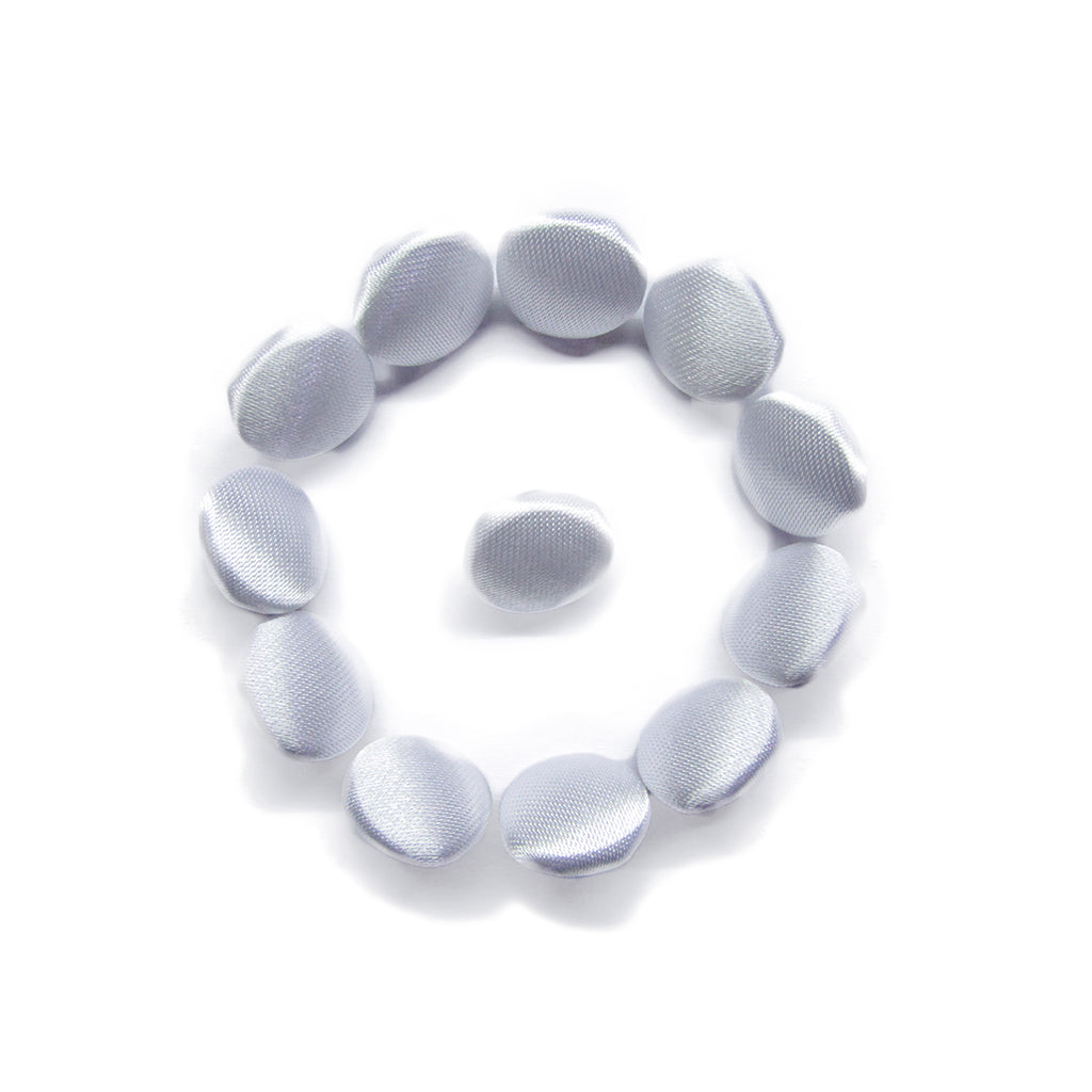 Eleven Silk Satin Bridal Buttons, round and white, are arranged in a circular pattern with one button in the center on a white background.