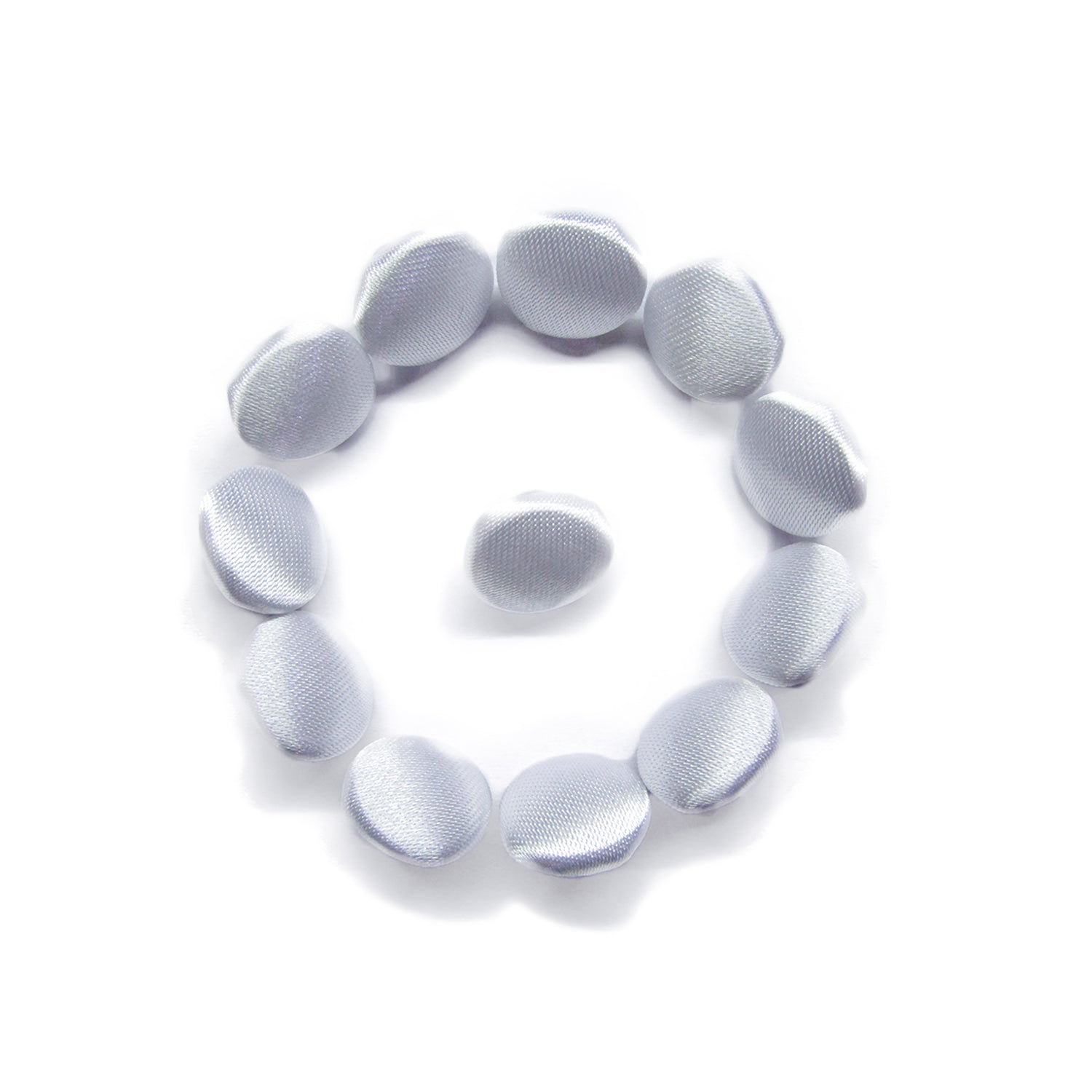 Eleven Silk Satin Bridal Buttons, round and white, are arranged in a circular pattern with one button in the center on a white background.