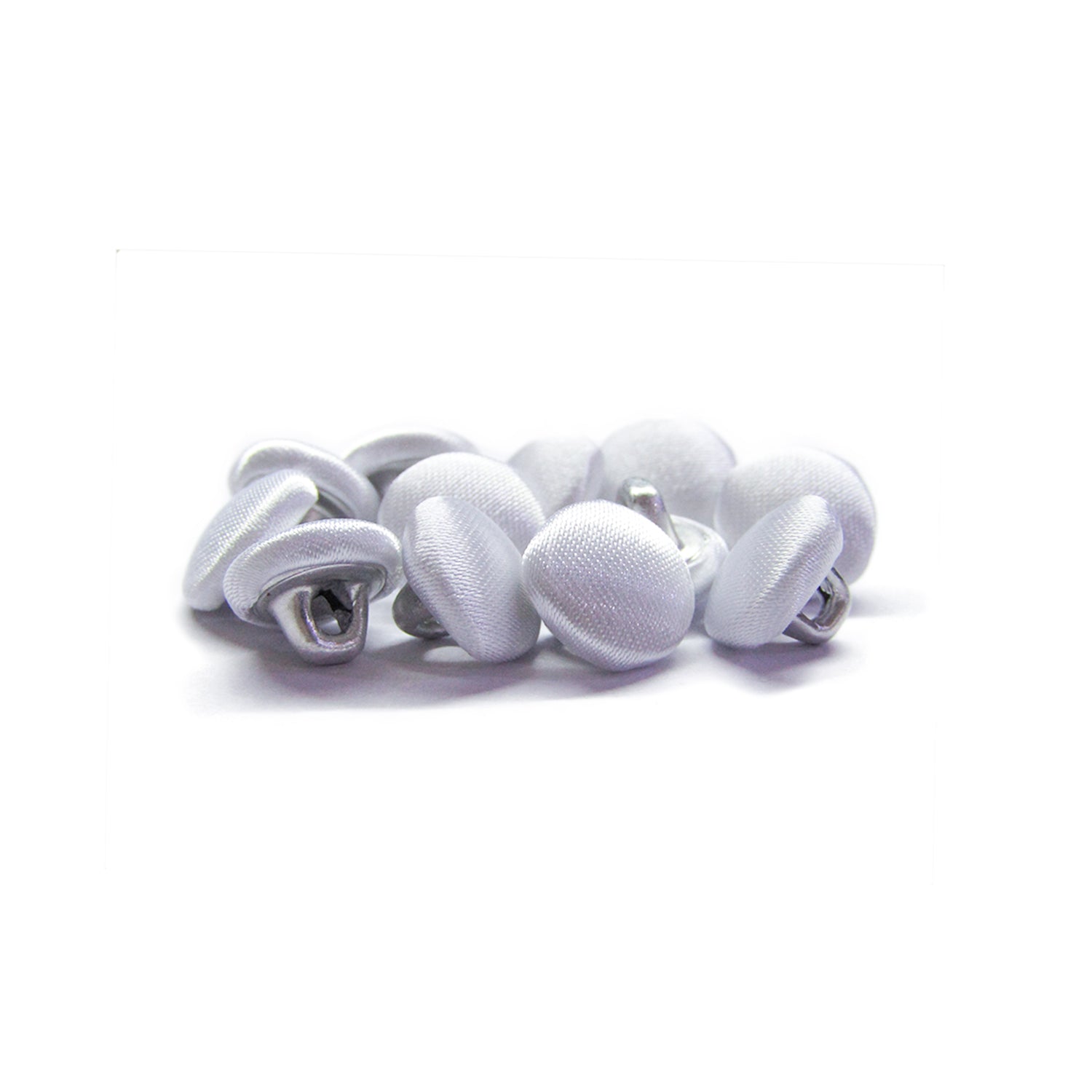 A pile of Silk Satin Bridal Buttons with metal shanks rests on a white background—ideal as delicate trim for wedding dresses.