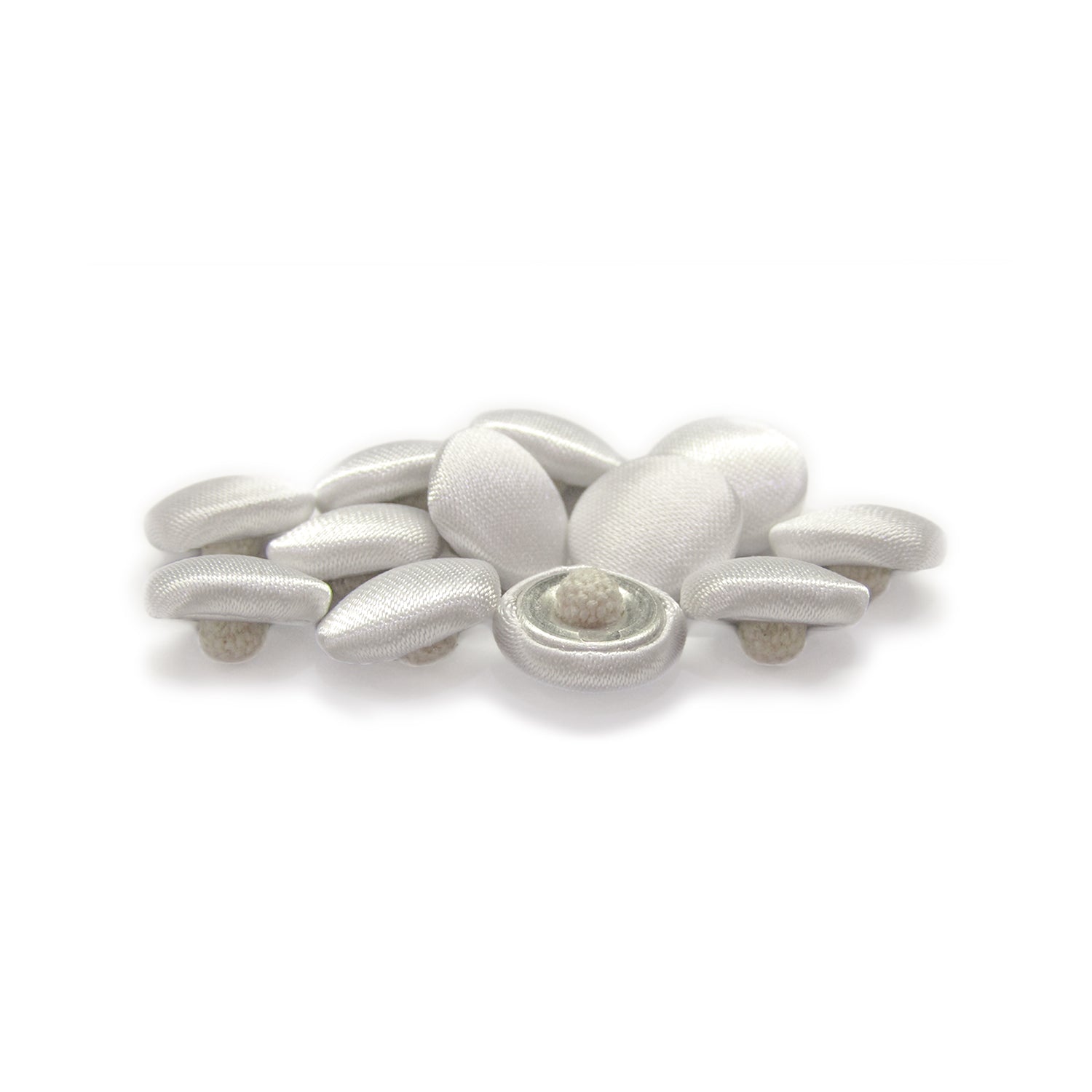Silk Satin Bridal Buttons, featuring small oval shapes, are elegantly clustered on a white background.