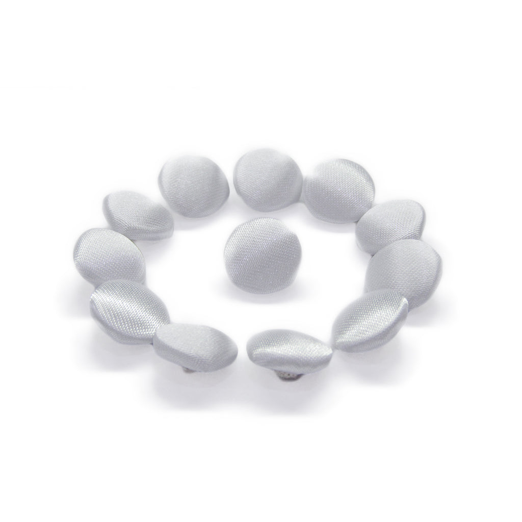 Ten Silk Satin Bridal Buttons are arranged in a circle around one button on a white background, highlighting the classic elegance perfect for bridal design.