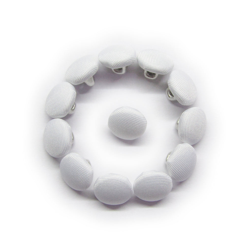 Twelve Taffeta Bridal Buttons in white are arranged in a circle around a central button, creating a smiley face design.