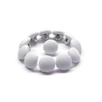 The Taffeta Bridal Buttons bracelet features white silk fabric buttons, inspired by elegant wedding dress details, displayed in a circular shape on a white background.