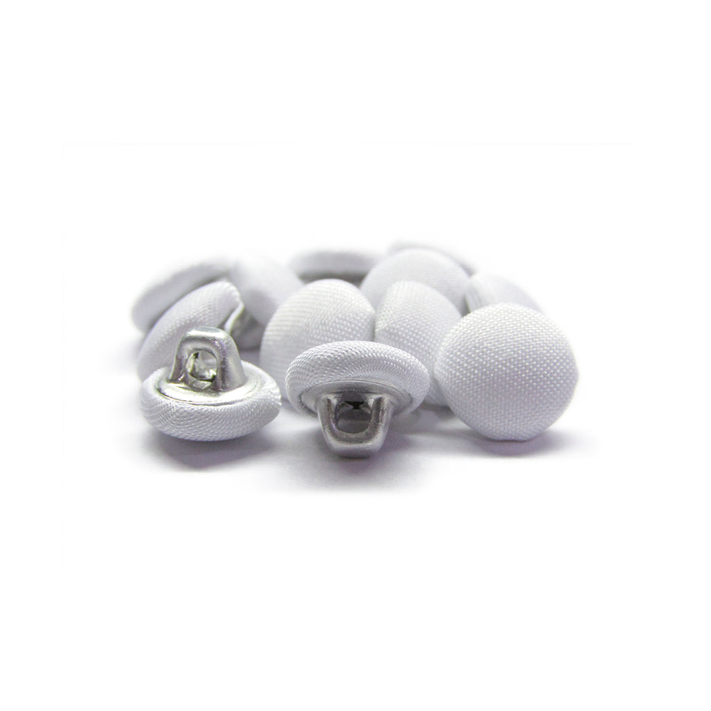 A pile of Taffeta Bridal Buttons, elegant silk fabric buttons often used for bridal attire, displayed on a white background.