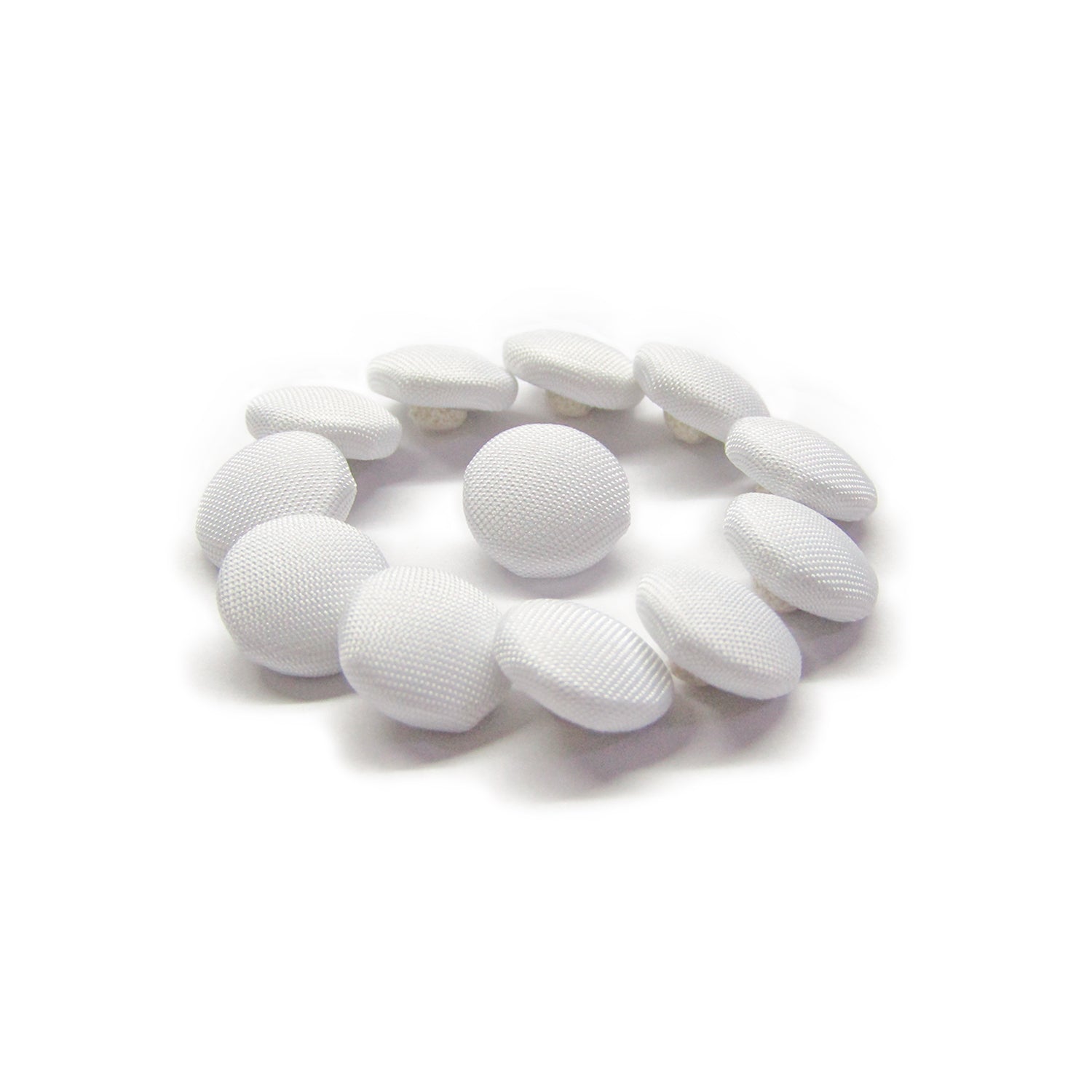 Twelve Taffeta Bridal Buttons, round and white, are arranged in a circle on a white background.