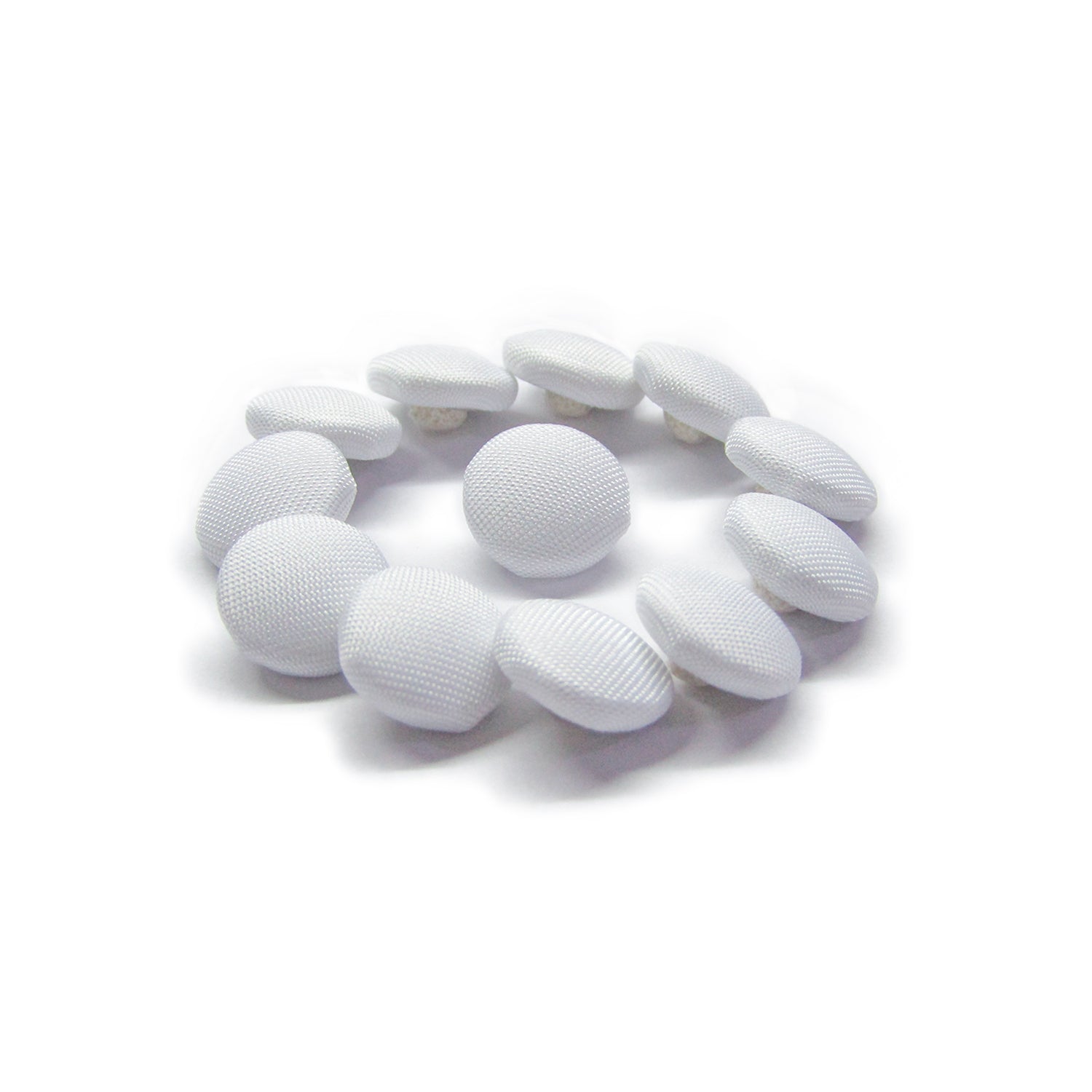 Twelve Taffeta Bridal Buttons are arranged in a loose circle on a white background, evoking classic bridal style—perfect for wedding dress embellishments.