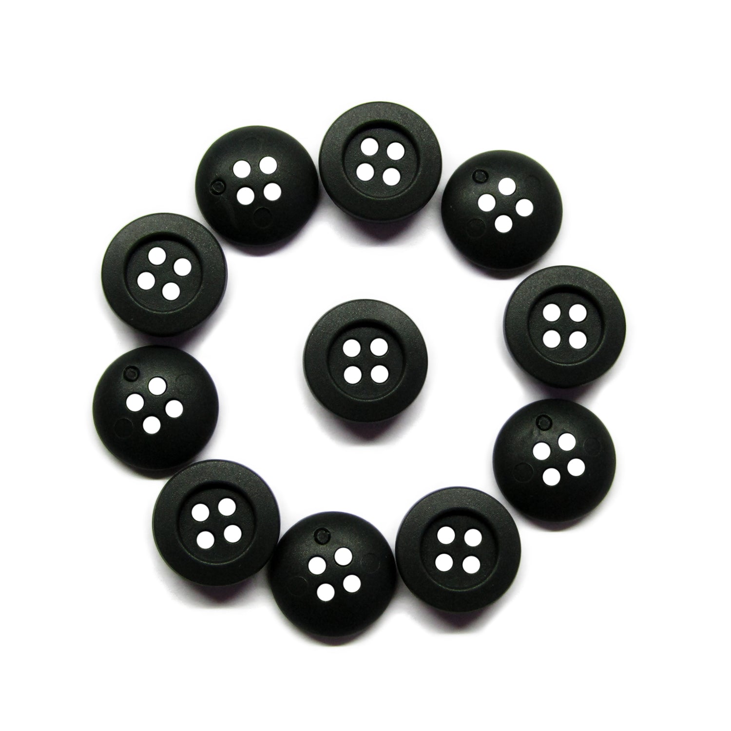 Twelve scratchproof black Rubber Shirt Buttons with four holes, arranged in a circle on a white background—ideal for children's clothing.