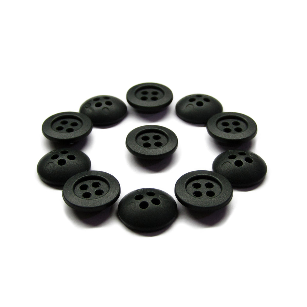 Ten black Rubber Shirt Buttons, each scratchproof with four holes, are arranged in a neat circle on a white background—perfect for children's clothing.
