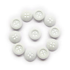 Eleven Rubber Shirt Buttons, ideal for children's clothing, are arranged in a circle on a white background.