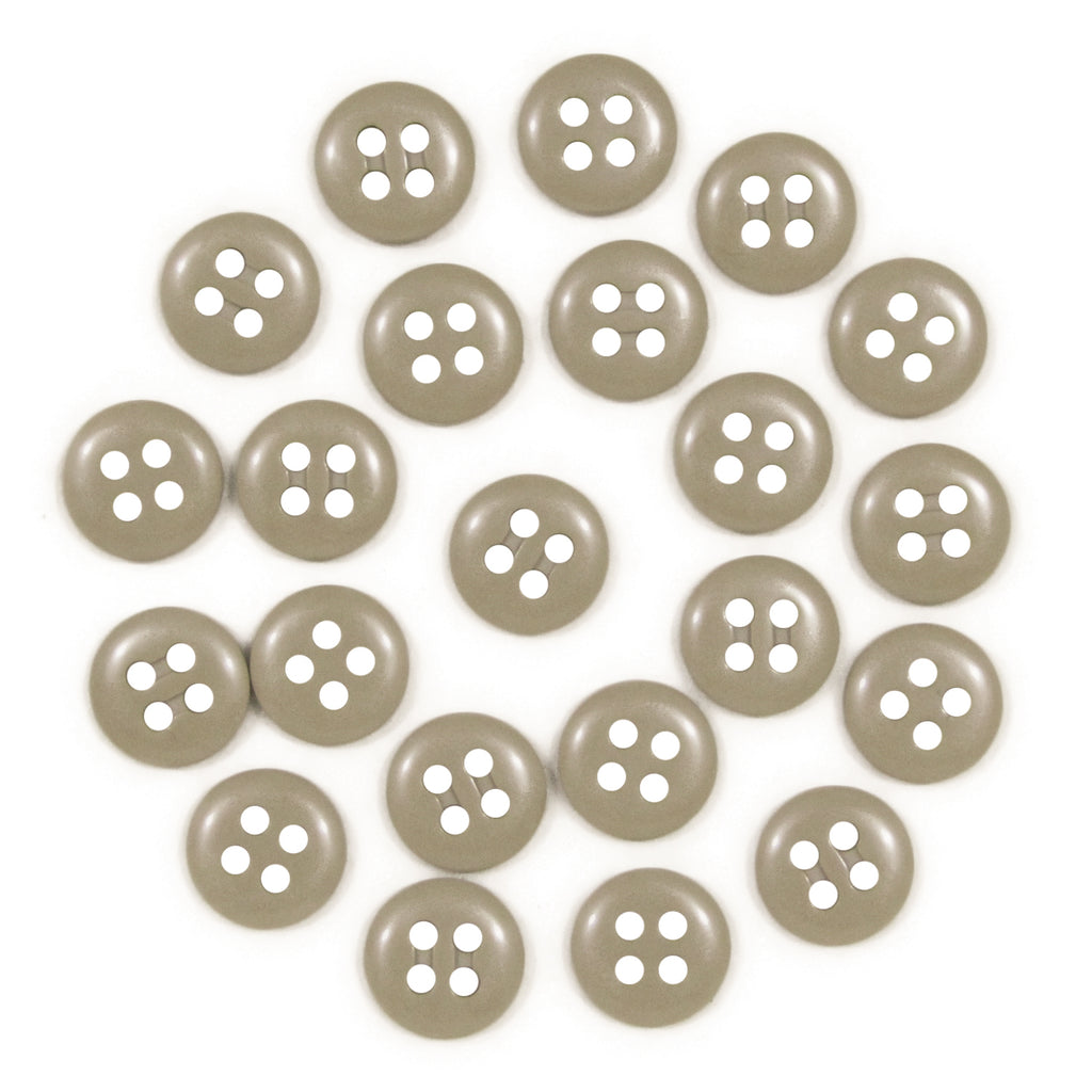 Twenty-four round, beige Trouser Fly Pant Buttons with four holes are arranged in a loose circle on a white background.
