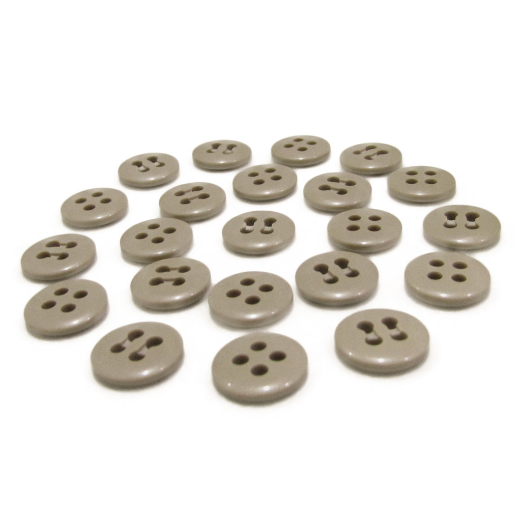 Twenty flat, round, gray Trouser Fly Pant Buttons—each with two or four holes—are arranged in neat rows on a white surface.